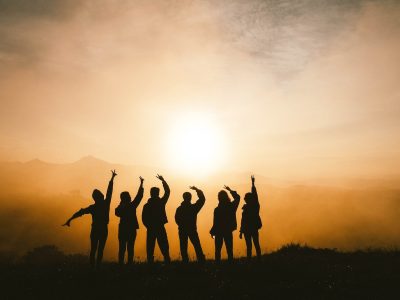 silhouette photo of six persons on top of mountain